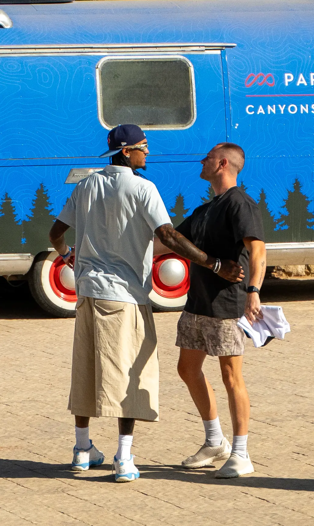 Coinlete partner and an athlete talking at a Park City brand activation